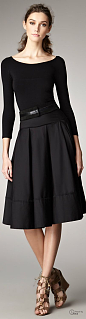 A ballerina-like bodice and ladylike pleated skirt bring charm to this Donna Karan LBD. Roman wedge.
