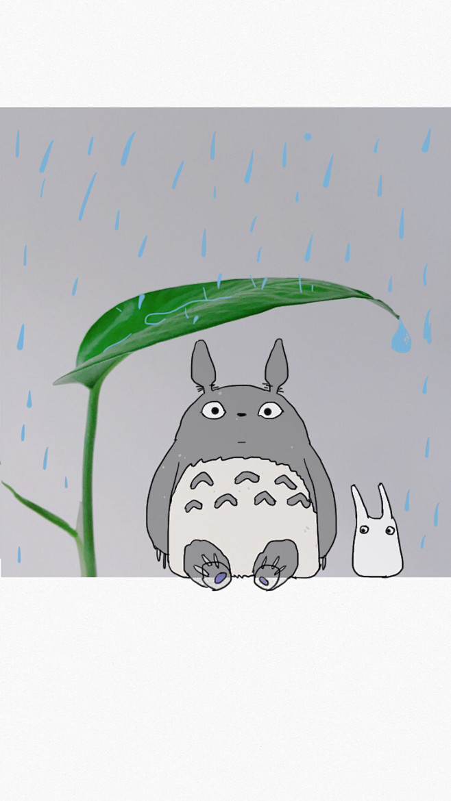 龙猫拿树叶挡雨图图片