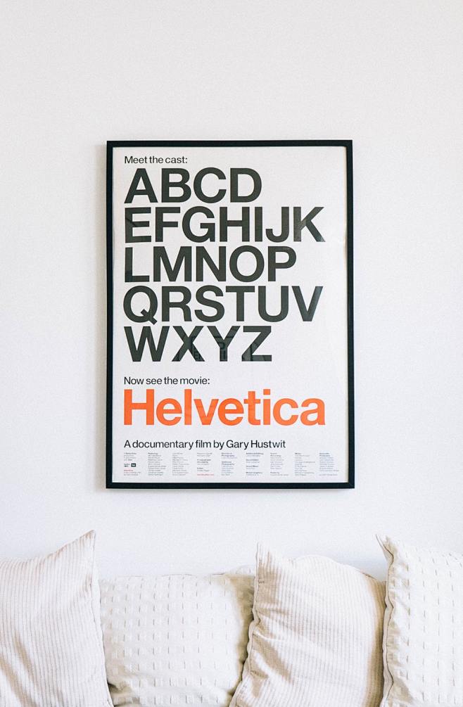 wallmountedhelveticaalphabetposterabovesofa